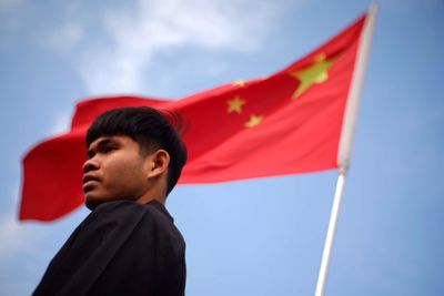 Low angle view of young man looking away