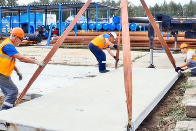 Rear view of man swinging at playground