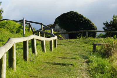 Built structure on land against sky