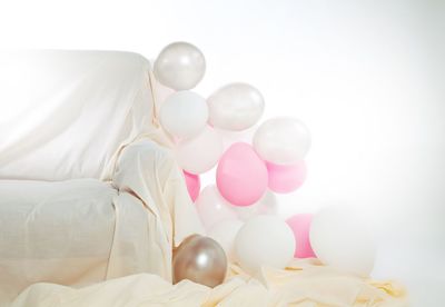 White balloons on bed