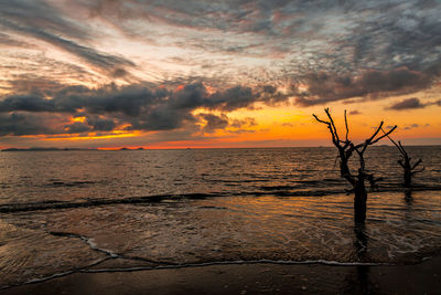 Scenic view of sea against dramatic sky