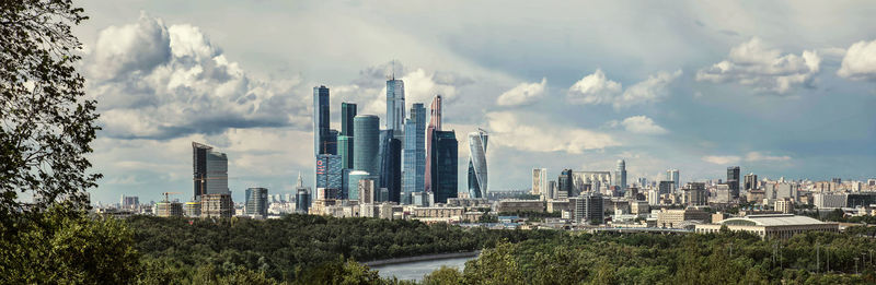 Panoramic view of city buildings against sky