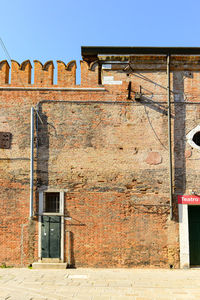 Low angle view of old building against clear sky