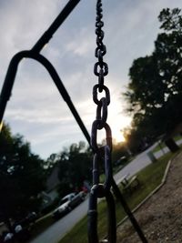 Close-up of chain against sky