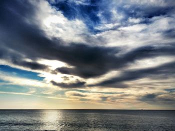 Scenic view of sea against dramatic sky