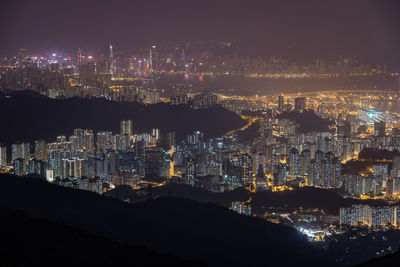 High angle view of illuminated city buildings at night