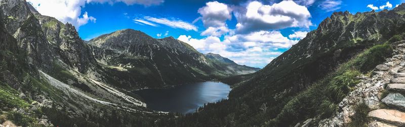 Panoramic view of river and mountains against sky