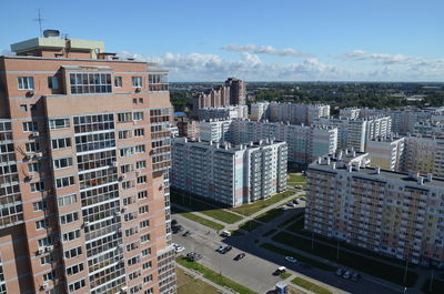 High angle view of buildings in city against sky