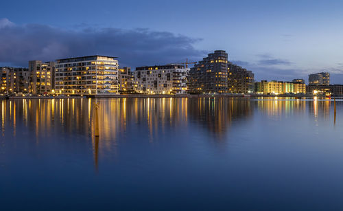 Reflection of illuminated buildings in water