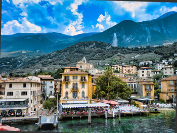 River by townscape against mountains