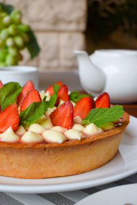 Close-up strawberry mousse pie served on table