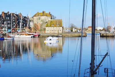 Boats moored at harbor