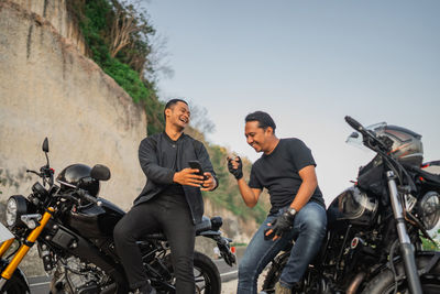 Friends riding motorcycle
