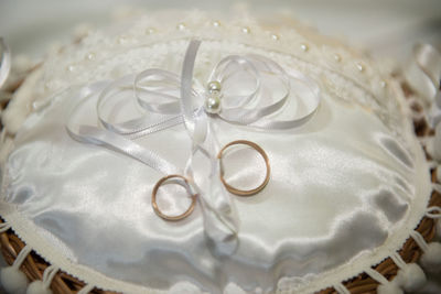 Close-up of wedding rings on table