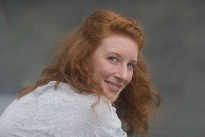 Portrait of a young woman outside looking