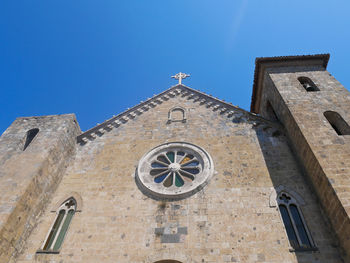 Low angle view of building against clear blue sky