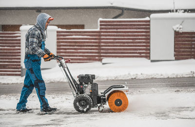 Man working on snow