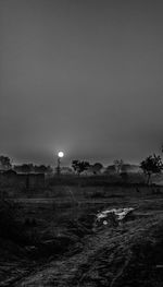 Scenic view of land against clear sky at dusk