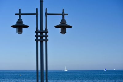 View of sea against clear blue sky