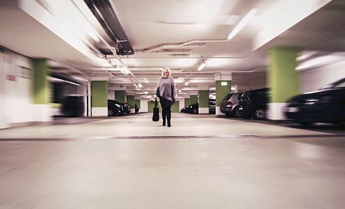 Woman walking in parking garage