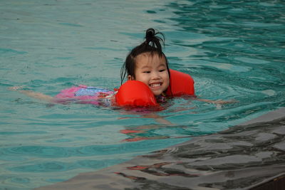 Portrait of boy in swimming pool