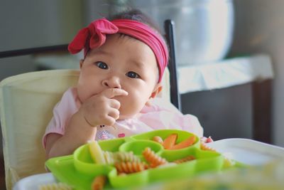 Portrait of cute baby at home