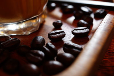 Close-up of coffee beans on table