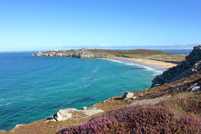 Scenic view of sea against clear blue sky