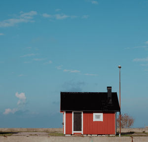 Built structure on beach against sky