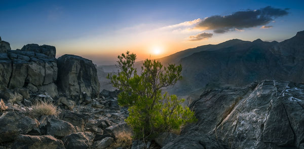 Scenic view of mountains against sky during sunset