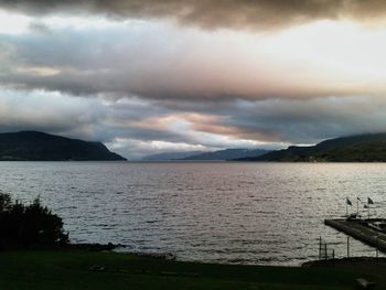 Scenic view of lake against cloudy sky