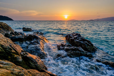 Scenic view of sea against sky during sunset