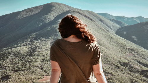 Rear view of woman looking at mountains