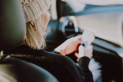 Midsection of woman using mobile phone