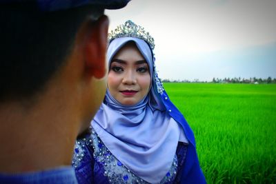 Portrait of beautiful young woman standing outdoors