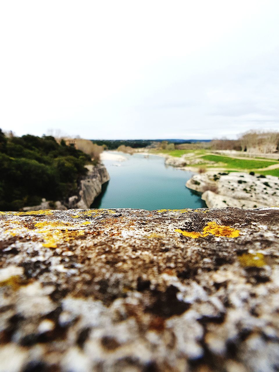 water, selective focus, sky, nature, no people, day, land, tranquility, beauty in nature, tranquil scene, sea, surface level, rock, outdoors, scenics - nature, close-up, solid, beach, rock - object