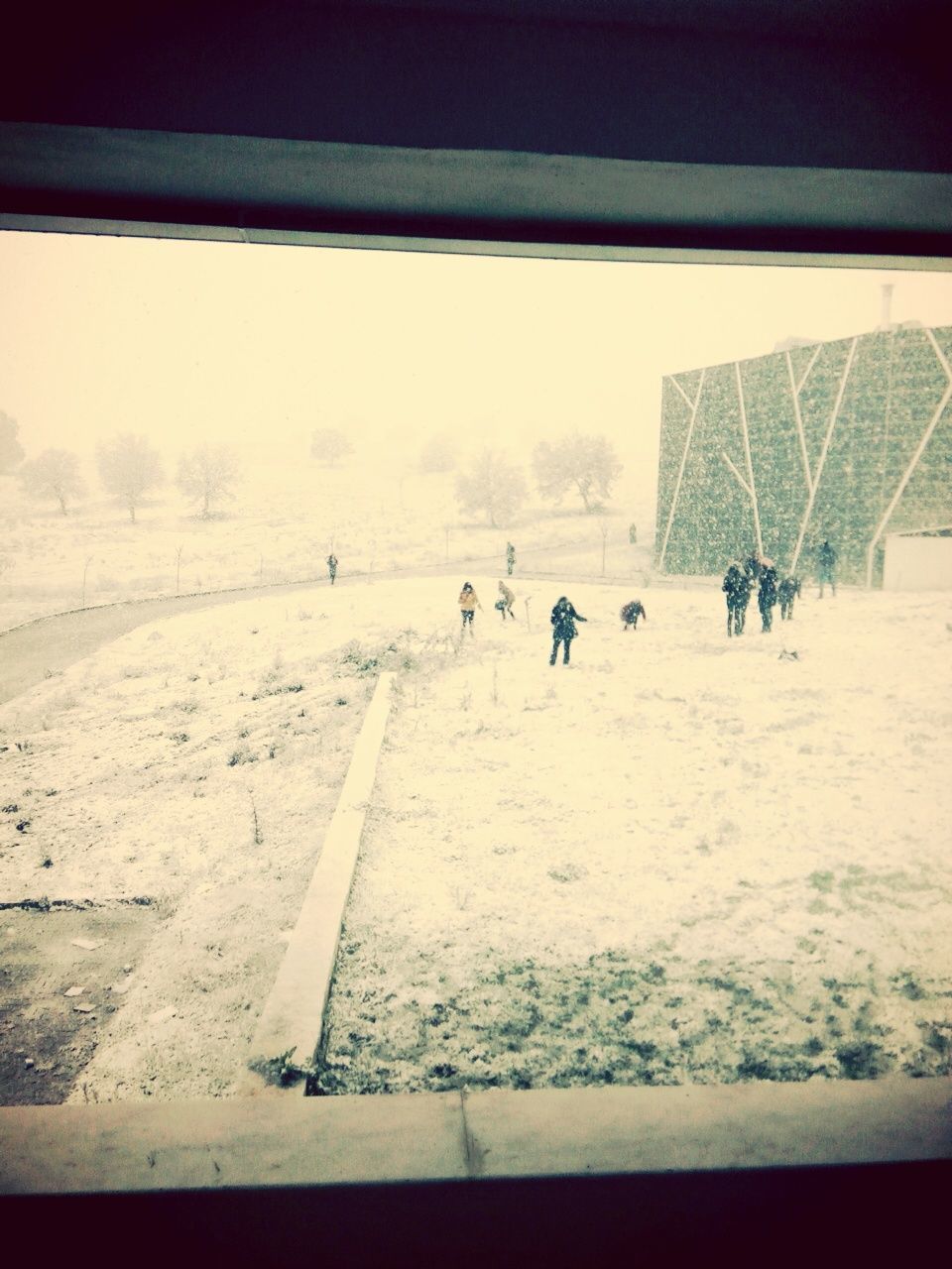 snow, winter, cold temperature, landscape, transportation, season, men, leisure activity, lifestyles, built structure, nature, weather, incidental people, large group of people, unrecognizable person, clear sky, day, field, architecture