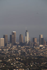 Modern buildings in city against sky