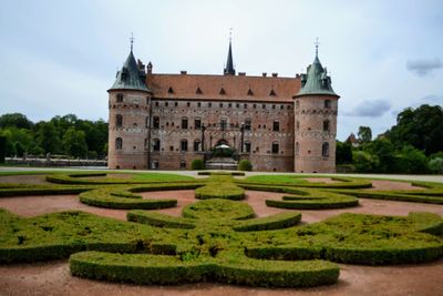 View of historical building in garden