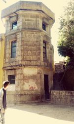 Woman standing in front of building