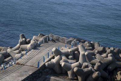 High angle view of seawall by sea