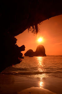 Scenic view of sea during sunset seen from cave