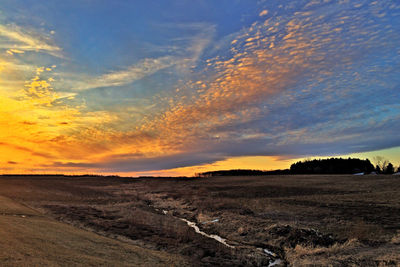 Scenic view of landscape at sunset