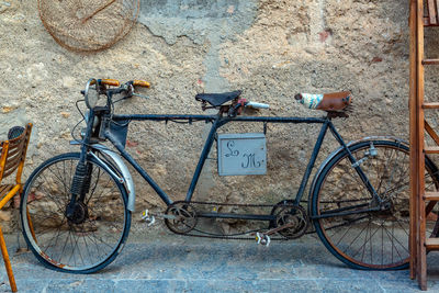 Bicycle leaning on wall