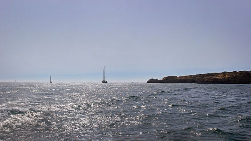 Scenic view of sea against clear sky