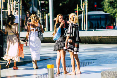 People walking on street in city