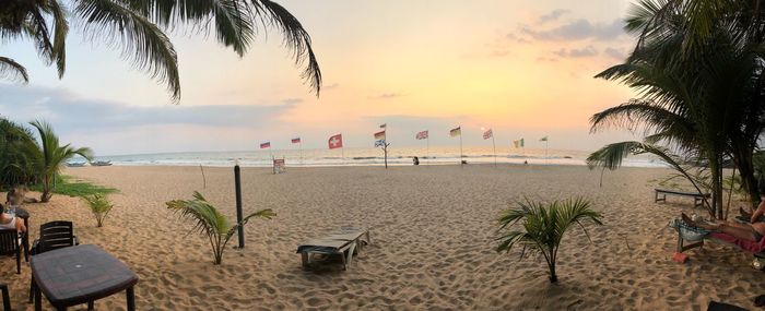 Scenic view of beach against sky during sunset