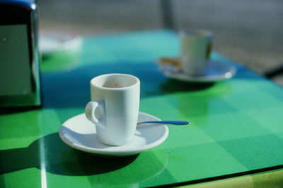 Close-up of coffee cup on table