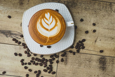 High angle view of cappuccino on table