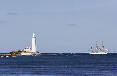 Sailboat in sea against sky